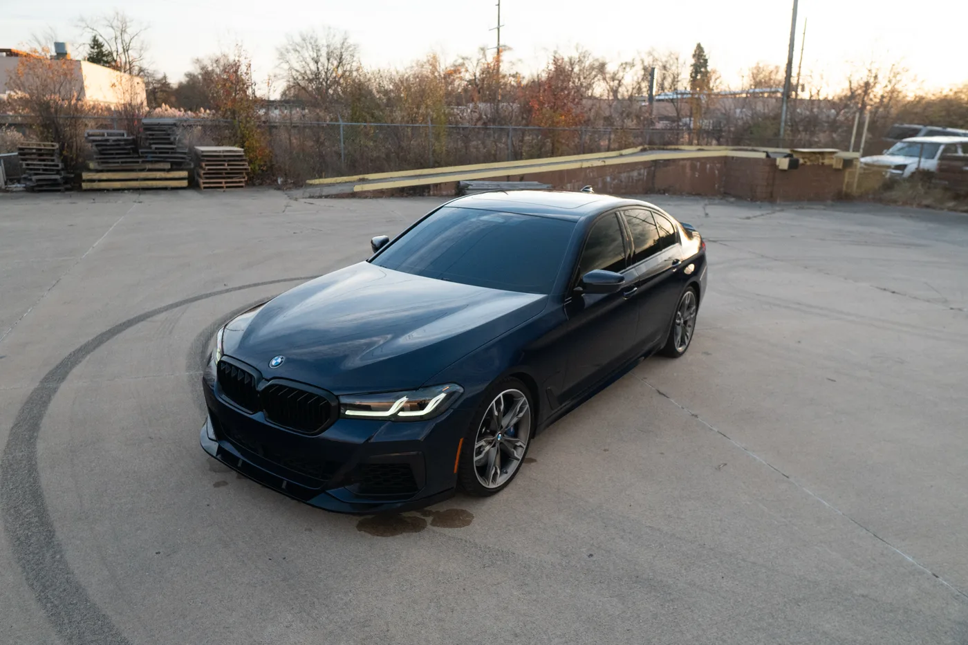 A blue BMW M5, front three-quarter view