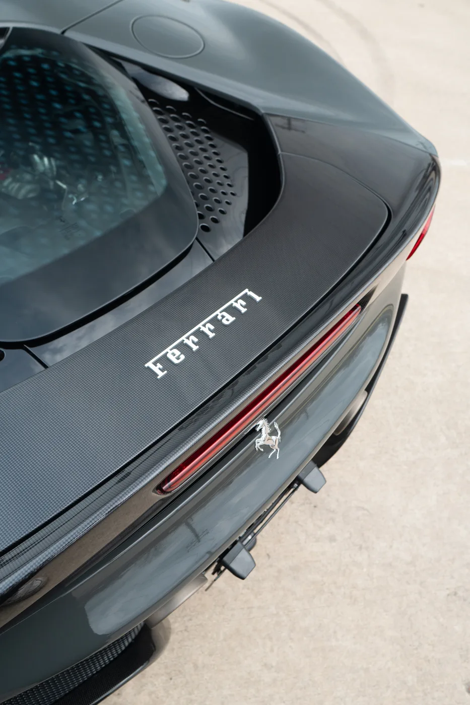 Ferrari lettering and taillight on a dark gray Ferrari