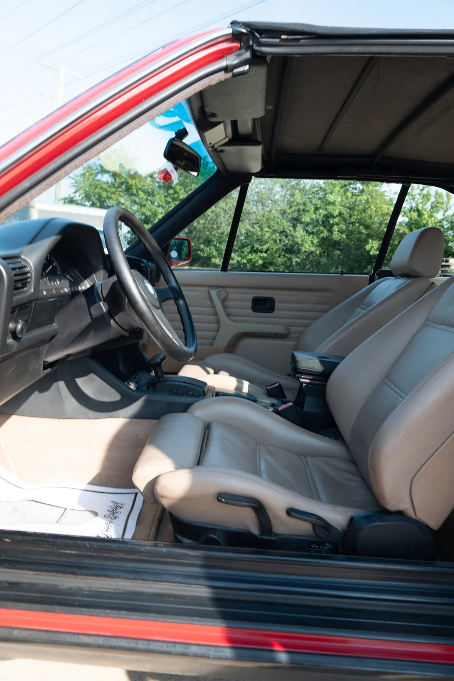The tan leather interior of a classic BMW convertible
