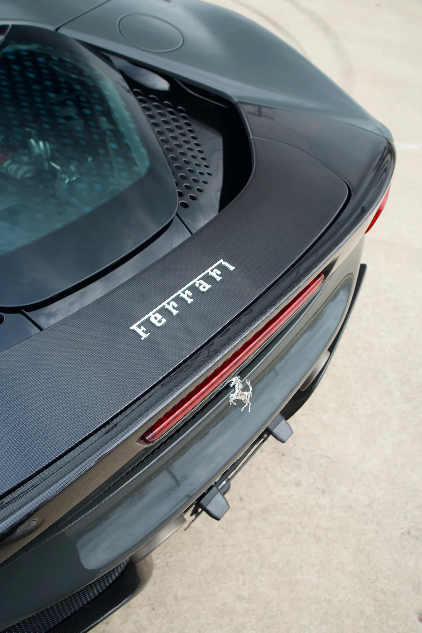 Rear badge detail on a Ferrari after paint correction